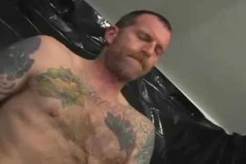 Two nasty Tattooed Leather Daddies