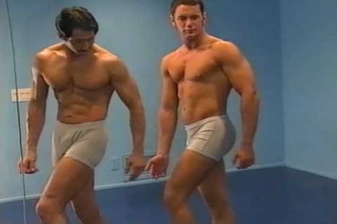 trainer Teaching His lad Flexing And Posing